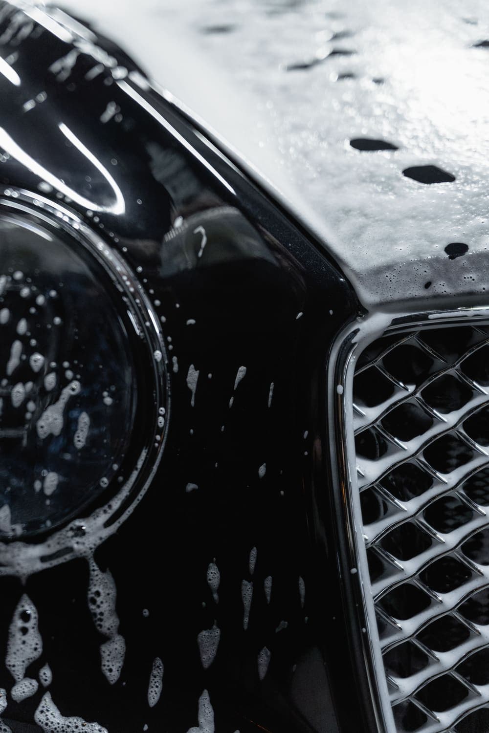 Snow foam pre-wash on a black car